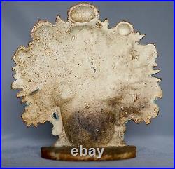 ANTIQUE CAST IRON DOORSTOP FLOWERS IN BASKET CIRCA 1920's Original Paint Rust