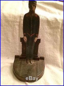 ANTIQUE CAST IRON DOORSTOP THE BELLHOP BY JUDD COMPANY