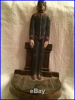 ANTIQUE CAST IRON DOORSTOP THE BELLHOP BY JUDD COMPANY