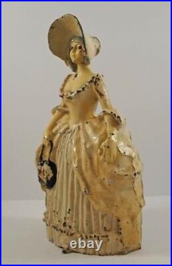 ANTIQUE COLONIAL LADY HOLDING PURSE CAST IRON DOORSTOP Ca. 1920's AMERICANA