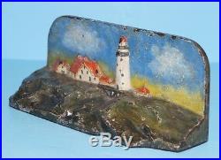 ANTIQUE LIGHTHOUSE WITH COTTAGES CAST IRON DOORSTOP NAUTICAL CIRCA 1920's