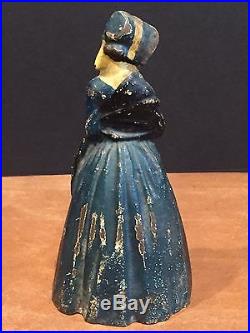 Antique Cast Iron Doorstop Bookend Colonial Lady in Dress with Flowers