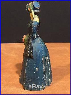 Antique Cast Iron Doorstop Bookend Colonial Lady in Dress with Flowers
