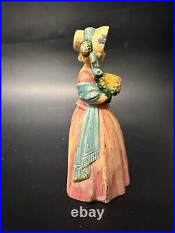 Antique Cast Iron Doorstop Colonial Woman with Flowers