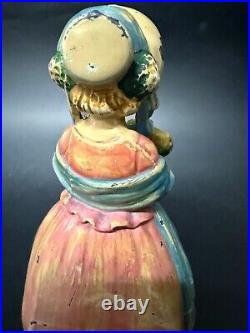 Antique Cast Iron Doorstop Colonial Woman with Flowers