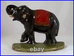 Antique Cast Iron Doorstop Colorful Elephant Raised Trunk & leg on Green Base Antique Cast Iron Doorstop Colorful Elephant Raised Trunk & leg on Green Base