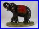 Antique_Cast_Iron_Doorstop_Colorful_Elephant_Raised_Trunk_leg_on_Green_Base_01_vuyg