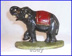 Antique Cast Iron Doorstop Colorful Elephant Raised Trunk & leg on Green Base Antique Cast Iron Doorstop Colorful Elephant Raised Trunk & leg on Green Base
