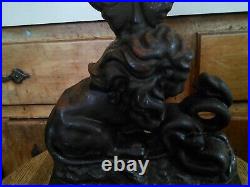 Antique Cast Iron Doorstop, Lion and Serpant signed