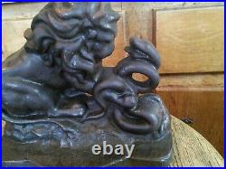 Antique Cast Iron Doorstop, Lion and Serpant signed
