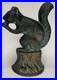 Antique_Cast_Iron_Squirrel_Door_Stop_Eating_A_Nut_Sitting_On_A_Stump_01_yctt