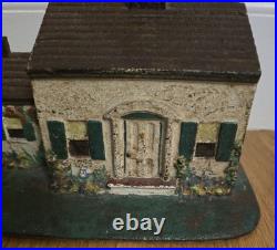 Antique Door Stop Heavy Cast Iron Cape style house 4 inches high by 7-1/4 wide