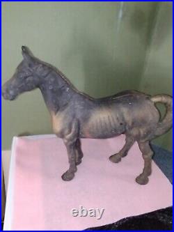 Antique cast iron horse bank or door stop, 10'' tall & 11'' long. A country look