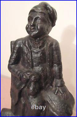 Antique heavy 1800's cast iron figural drinking man with stein ale house doorstop