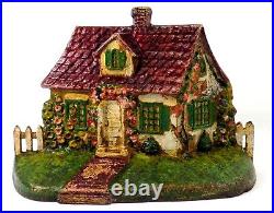 LATE 19TH C ANTIQUE CAST IRON COTTAGE DOORSTOP IN ORIG PAINT, WithFENCING, FLOWERS