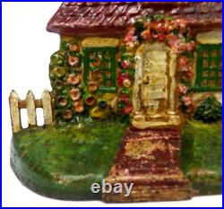 LATE 19TH C ANTIQUE CAST IRON COTTAGE DOORSTOP IN ORIG PAINT, WithFENCING, FLOWERS