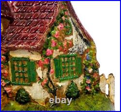 LATE 19TH C ANTIQUE CAST IRON COTTAGE DOORSTOP IN ORIG PAINT, WithFENCING, FLOWERS