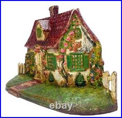 LATE 19TH C ANTIQUE CAST IRON COTTAGE DOORSTOP IN ORIG PAINT, WithFENCING, FLOWERS