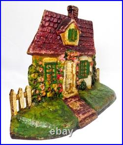 LATE 19TH C ANTIQUE CAST IRON COTTAGE DOORSTOP IN ORIG PAINT, WithFENCING, FLOWERS