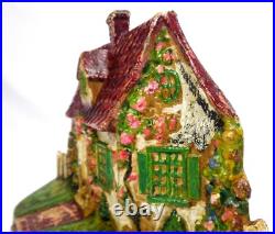 LATE 19TH C ANTIQUE CAST IRON COTTAGE DOORSTOP IN ORIG PAINT, WithFENCING, FLOWERS