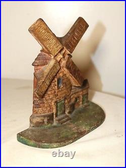 Original antique hand painted heavy cast iron figural windmill house doorstop