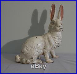Painted cast iron seated rabbit figure doorstop American late 19th early 20thc