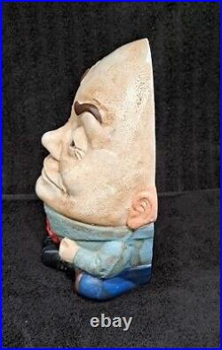Painted figural cast iron Humpty Dumpty doorstop. 9 3/8 H. American, early 20th