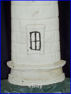 RARE PAIR OF MONUMENTAL ANTIQUE CAST IRON PAINTED LIGHTHOUSE DOORSTOPS