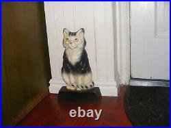 VINTAGE CAST IRON SITTING BLACK and white kitty CAT DOORSTOP patina antique 12
