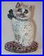 Vintage_Cast_Iron_Doorstop_Colorful_Cat_with_Blue_Bow_Sitting_Up_on_Pink_Pillow_01_bnxc